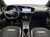 the interior of a car with a steering wheel, dashboard, and dashboard lights