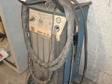a welding machine that is sitting in a room