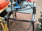 an image of a workbench with a machine on it