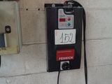 a payphone attached to a wall in a building