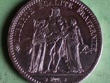 an image of a coin with a picture of a man and a woman on it