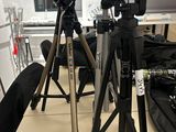 two tripods that are sitting on a table in a room