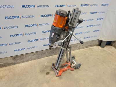 an image of a drill on a stand in front of a wall