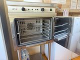 an open oven that is sitting in a kitchen