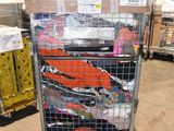 many boxes of clothing on a cart in a warehouse