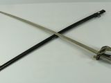 two swords on a white table with a black handle