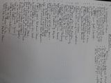 a piece of paper with writing on it sitting on a table