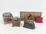a small box with a picture on it next to other items