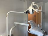 a dentist chair in the corner of a room