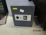 a safe box sitting on the floor in a room