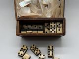 an open box of dominos sitting on top of a table