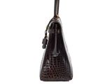 a brown crocodile skin handbag on a white background