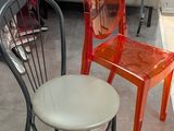 two chairs sitting next to each other in a room