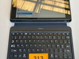 a laptop and a tablet on a table with a price tag on it