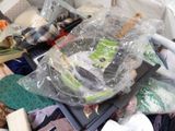 a pile of clothes and other items in a plastic container