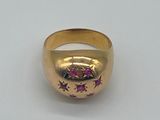an image of a close up of a gold ring on a white surface