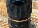a close up of a camera lens on a wooden table