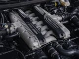 the engine of a car with its hood open and the hood down