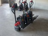 many different types of hand trucks in a garage