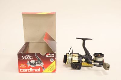 a box with a fishing reel next to a box with a fishing rod
