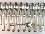 a lot of spoons and spoon spoons on a table