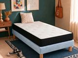 an image of a bedroom with a bed and a rug