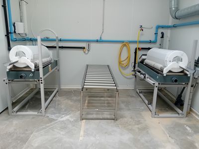 two machines that are sitting in a room