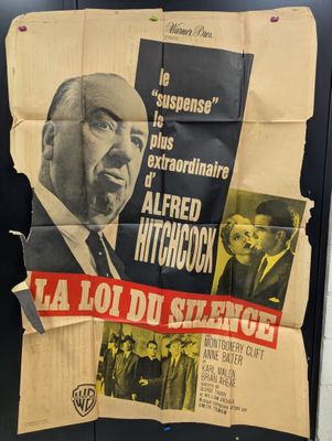 a poster of a man in a suit and tie on a wall