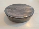 a small silver box sitting on a table