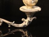 a candle that is sitting on a black table