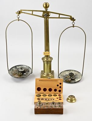 une image représentant une balance sur laquelle sont posées des pièces de monnaie