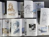 a lot of drawings on the pages of a book
