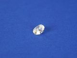 a white diamond on a blue surface