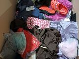 a box full of clothes and shoes that are in it