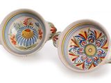 two bowls that are sitting next to each other on a table