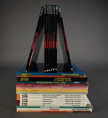 several books stacked on top of each other on a table