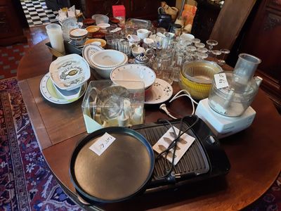 many plates and pans on the table ready to be cooked