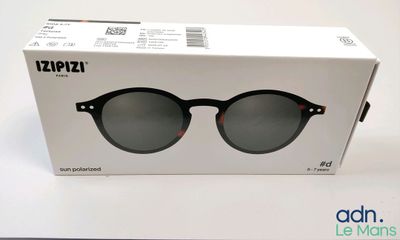 an open box of a pair of sunglasses sitting on top of a table