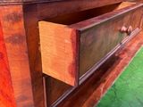 a wooden table with a drawer on top of it