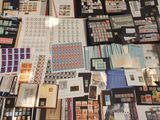 many different stamps on a table with a lot of them