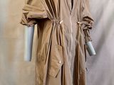 an image of a mannequin dressed in a trench coat