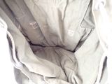 a close up of a bag with a cat inside of it