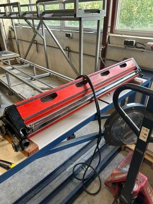 a machine that is working on a piece of metal