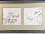 two framed asian paintings of birds and flowers on a wall