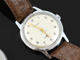 an image of a close up of a wrist watch on a table