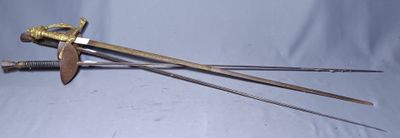 two swords and a knife on a blue cloth