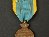 a close up of a medal on a black surface