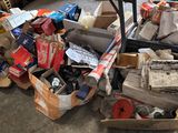 a pile of boxes and other items on the floor