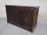 an old wooden cabinet with a door on the top of it