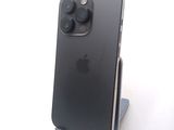 a black iphone sitting on a stand on a white surface